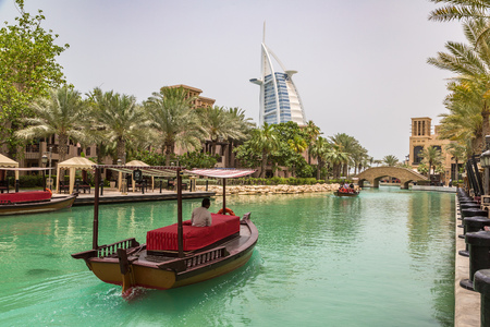DUBAI, UAE - JUNE 26, 2018: View at Burj Al arab hotel from Madinat Jumeirah luxury hotel in a summer day in Dubai, United Arab Emiratesのeditorial素材
