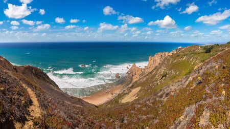 Cabo da Roca. Cliffs and rocks on the Atlantic ocean coast in Sintra in a beautiful summer day, Portugalの写真素材