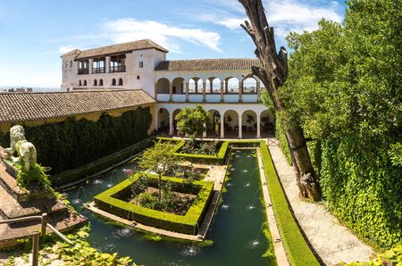 Garden and Bell Tower in Alhambra palace in Granada in a beautiful summer day, Spainのeditorial素材