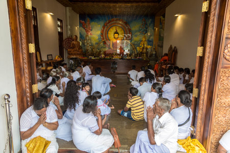 ANURADHAPURA, SRI LANKA - FEBRUARY 12, 2020: Prayer people in Big white Ruwanwelisaya stupa in...