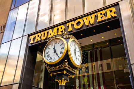 NEW YORK CITY, USA - MARCH 29, 2020: Street clock and Trump Tower building in New York City, NY, USA