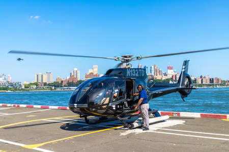 NEW YORK CITY, USA - MARCH 29, 2020: Helicopter flying at manhattan in New York City, NY, USAのeditorial素材