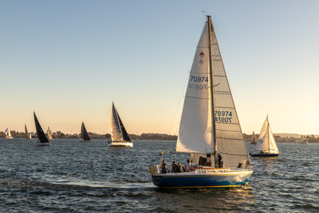 SAN DIEGO, USA - MARCH 29, 2020: Many sail boats sailing in the bay in San Diego at sunset,...