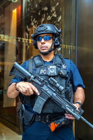 NEW YORK CITY, USA - MARCH 29, 2020: Police officer stand guard in front of entrance at Trump Tower...