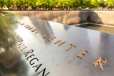 NEW YORK CITY, USA - MARCH 29, 2020: Memorial plaque at 9/11 Memorial park in New York City, NY, USA