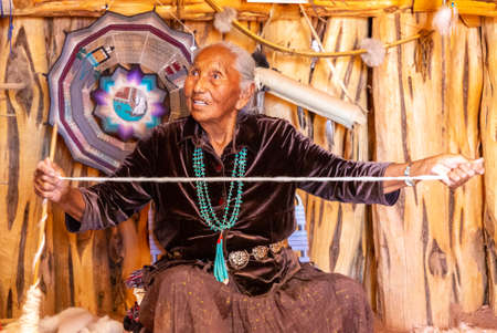 ARIZONA, USA - MARCH 29, 2020: Old Navajo woman in Navajo nation reservation at Monument Valley, Arizona, USAのeditorial素材