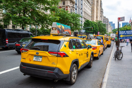 NEW YORK CITY, USA - MARCH 29, 2020: Yellow taxi on Fifth Avenue in New York City, NY, USA