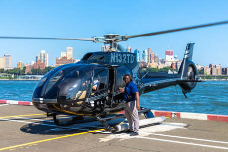 NEW YORK CITY, USA - MARCH 29, 2020: Helicopter flying at manhattan in New York City, NY, USAのeditorial素材