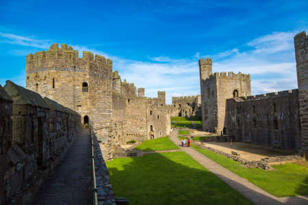 CAERNARFON, WALES - JUNE 15, 2016: Caernarfon Castle in Wales in a beautiful summer day, United Kingdom on June 15, 2016のeditorial素材