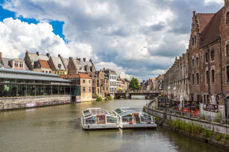 GENT, BELGIUM - JUNE 14, 2016: Canal in the old town in Gent in a beautiful summer day, Belgiumのeditorial素材