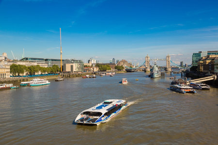 LONDON, UNITED KINGDOM - JUNE 14, 2016: HMS Belfast warship and Tower Bridge in London in a beautiful summer day, England, United Kingdomのeditorial素材