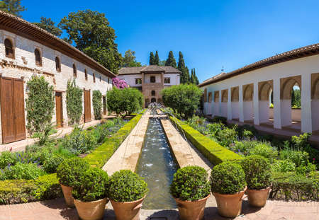 Garden and Bell Tower in Alhambra palace in Granada in a beautiful summer day, Spainのeditorial素材