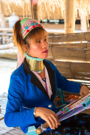 CHIANG RAI, THAILAND - MARCH 29, 2018: Portrait of a long neck woman in village near Chiang Rai, Thailand in a summer dayのeditorial素材