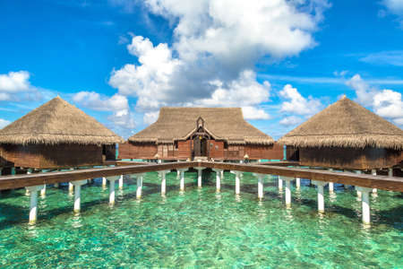 Water Villas (Bungalows) and wooden bridge at Tropical beach in the Maldives at summer dayのeditorial素材