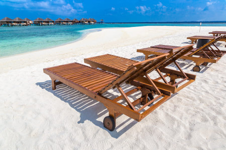 Wooden sunbed on tropical beach in the Maldives at summer dayのeditorial素材