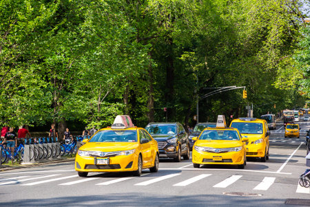 NEW YORK CITY, USA - MARCH 29, 2020: Yellow taxi on Fifth Avenue in New York City, NY, USA