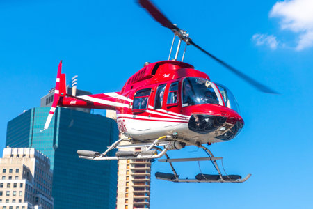 NEW YORK CITY, USA - MARCH 29, 2020: Helicopter flying at manhattan in New York City, NY, USA