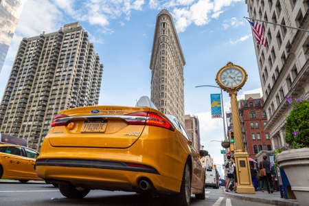 NEW YORK CITY, USA - MARCH 15, 2020: Taxi and Flatiron Building in New York City, USAのeditorial素材