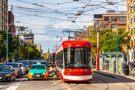 TORONTO, CANADA - APRIL 2, 2020: Modern tram in Toronto in a sunny day, Ontario, Canadaのeditorial素材