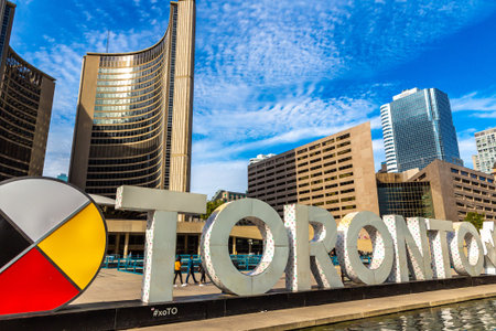 TORONTO, CANADA - APRIL 2, 2020: Toronto sign and city hall at Nathan Phillips Square in Toronto in...