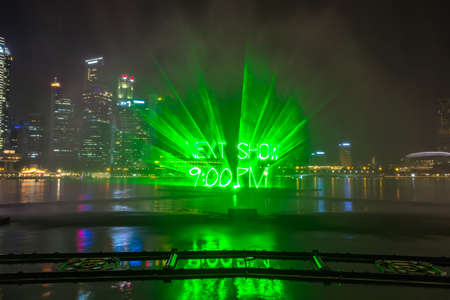 SINGAPORE - JUNE 23, 2018: Fountains night laser show in Singapore near Marina Bay Sands hotel at summer nightのeditorial素材