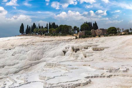 Travertine pools and terraces in Pamukkale, Turkey in a beautiful summer dayの写真素材