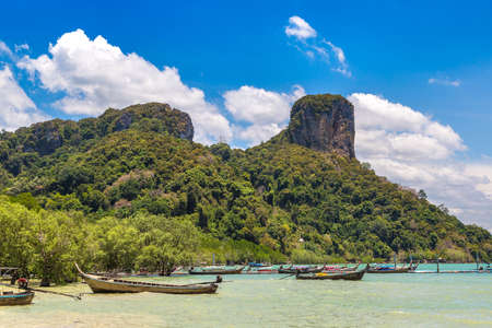 Thai traditional wooden longtail boat at Railay East Beach in Krabi, Ao Nang, Thailandの写真素材