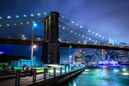 Brooklyn Bridge and panoramic night view of downtown Manhattan after sunset in New York City, USAの写真素材