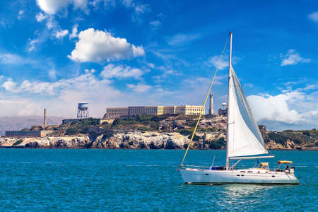 Sailing yacht against Alcatraz prison Island in San Francisco, California, USAのeditorial素材