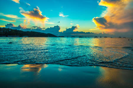 Sunset at Patong beach in Phuket, Thailandの写真素材