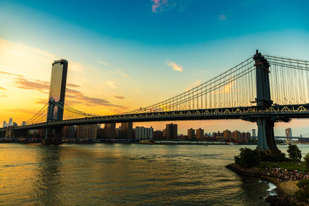 Manhattan Bridge and panoramic sunset view of downtown Manhattan after sunset in New York City, USAの写真素材