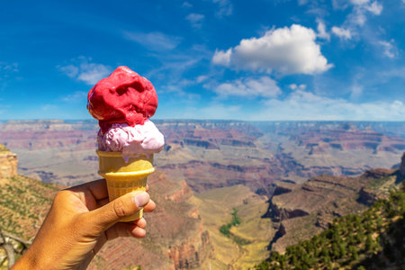 Man hand holding an ice cream at Grand Canyon National Park in a sunny day, Arizona, USA