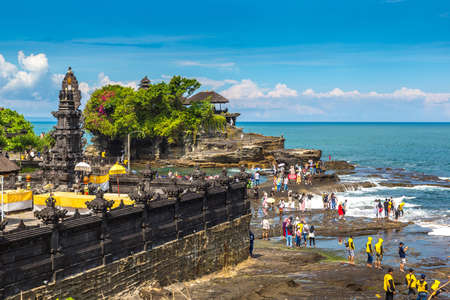 BALI, INDONESIA - FEBRUARY 28, 2020:  Panoramic view of Tanah Lot temple on Bali, Indonesia in a sunny dayのeditorial素材