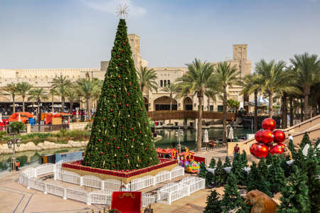 DUBAI, UAE - DECEMBER 25, 2019: View at Burj Al arab hotel from Madinat Jumeirah and Christmas tree in Dubai, United Arab Emiratesのeditorial素材