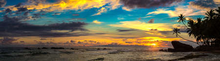 Panorama of  Sunset at Dalawella beach in Sri Lankaの写真素材