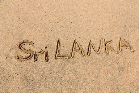 Word Sri Lanka written in a sandy on tropical beach in Sri Lankaの写真素材