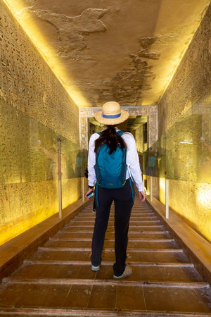 Woman traveler at Tomb of pharaoh Rameses III in Valley of the Kings, Luxor, Egypt