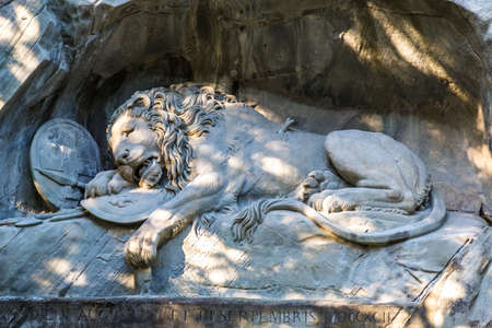 Dying lion monument in Lucerne in a beautiful summer day, Switzerlandの写真素材