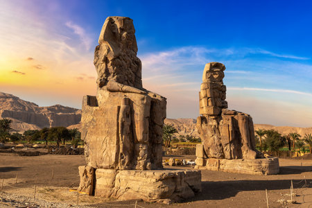 Colossi of Memnon in Luxor, Valley of Kings, Egypt in a sunny dayの写真素材