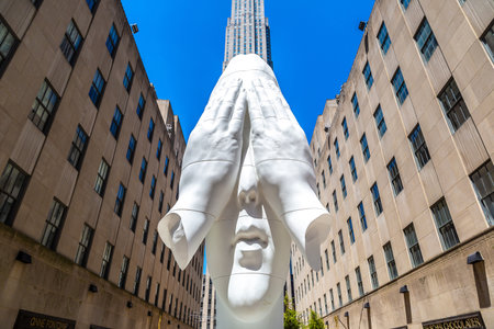 NEW YORK CITY, USA - MARCH 15, 2020: Behind the walls, Frieze Sculpture at Rockefeller Center in Manhattan, New York City, USAのeditorial素材