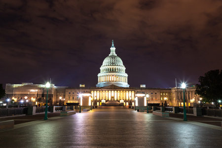 The United States Capitol building at sunset at night in Washington DC, USA