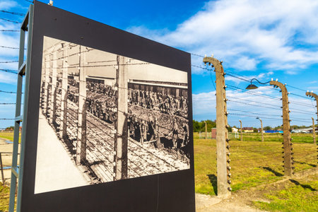 OSWIECIM, POLAND - SEPTEMBER 7, 2022: Photo Exhibition in Auschwitz II concentration camp in a sunny day, Oswiecim, Polandのeditorial素材