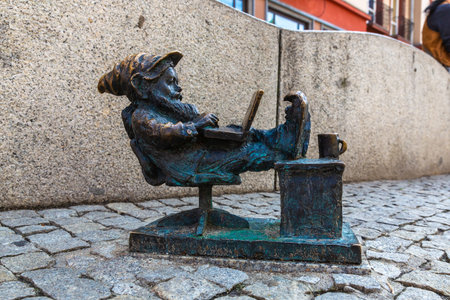 WROCLAW, POLAND - SEPTEMBER 21, 2022: Symbol of Wroclaw - Sculpture of dwarf (gnome) from fairy-tale in a sunny day, Wroclaw, Polandのeditorial素材