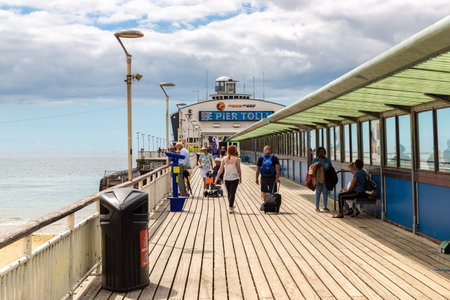 BOURNEMOUTH, THE UNITED KINGDOM - JUNE 25, 2022: Bournemouth Pier in a summer day in Bournemouth, Dorset, UKのeditorial素材