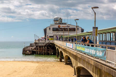 BOURNEMOUTH, THE UNITED KINGDOM - JUNE 25, 2022: Bournemouth Pier in a summer day in Bournemouth, Dorset, UKのeditorial素材