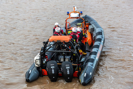 KINGSTON UPON HULL, UK - JUNE 2, 2022: Cowes Lifeboat in action in Hull in a sunny day, Kingston...