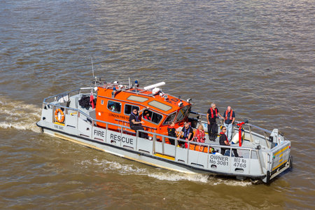 LONDON, UK - JUNE 17, 2022: Fire rescue boat on the River Thames in a sunny summer day in London, UKのeditorial素材