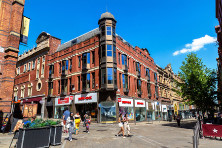LEEDS, UK - JUNE 16, 2022: Typical street in a sunny summer day in Leeds, West Yorkshire, UK