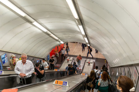 LONDON, THE UNITED KINGDOM - JUNE 26, 2022: Escalator in London Underground Tube Station in London, England, UKのeditorial素材