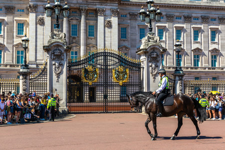 LONDON, UK - JUNE 17, 2022: Metropolitan mounted police patrolling at changing of the guard ceremony...
